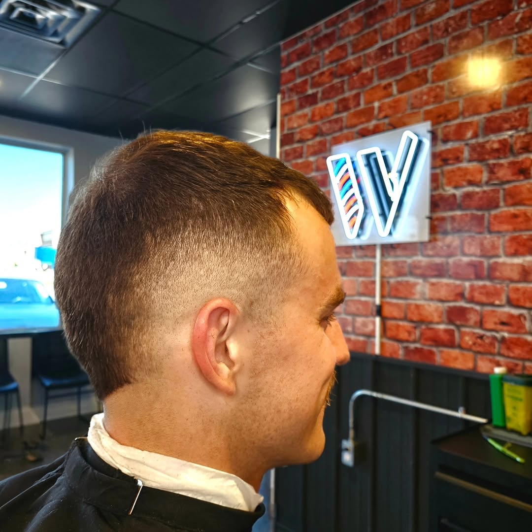 Skin fade with textured top, side profile