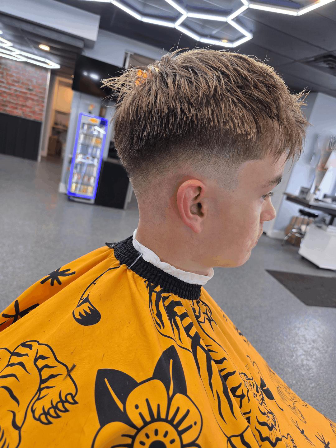 Textured fringe with a low taper fade