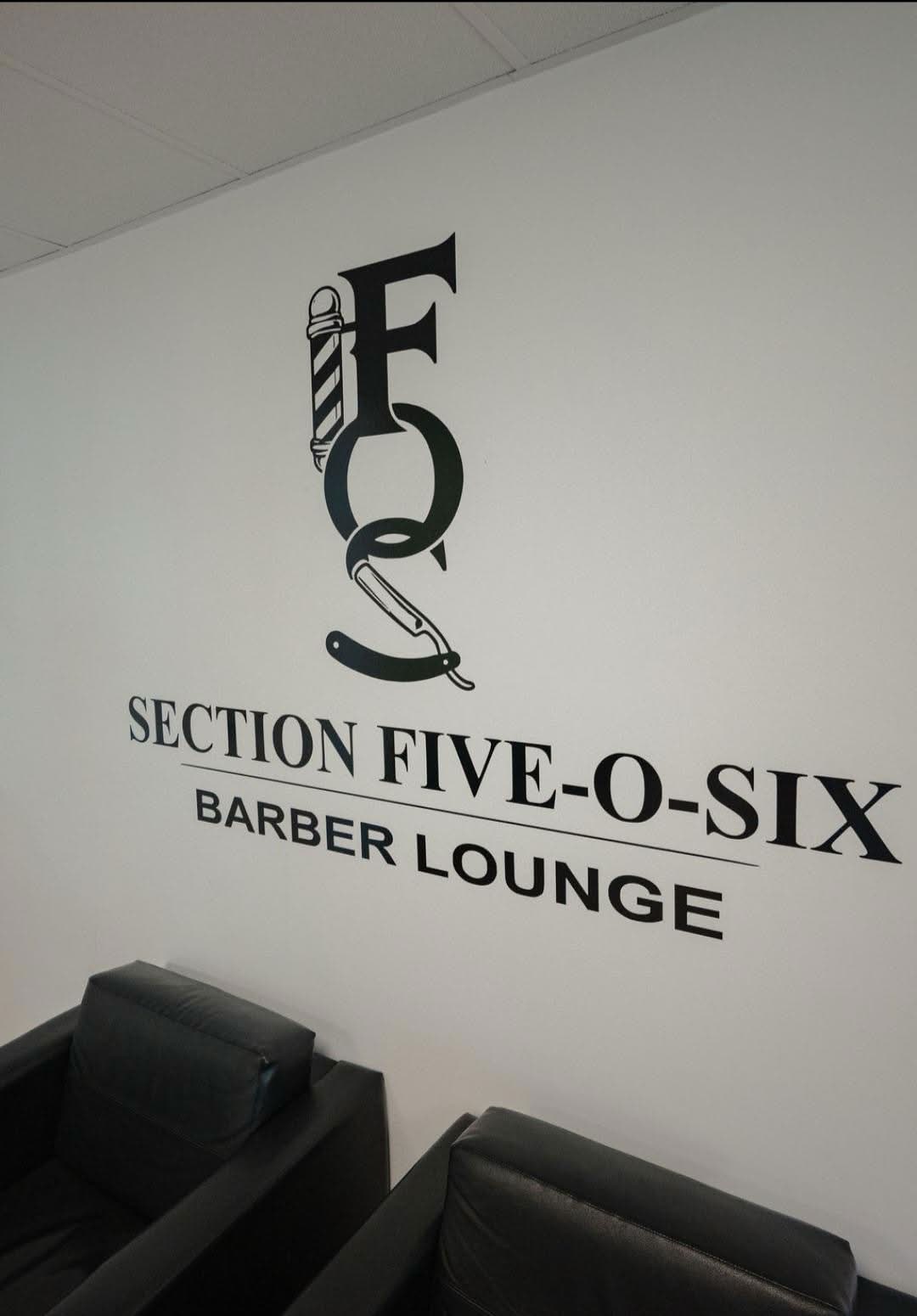 The Section Five-O-Six logo painted above the waiting chairs